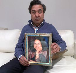 Vancouver businessman Sanjay Goel and his father Dr. Sadan Goel holding a portrait of the murdered Dr. Asha Goel